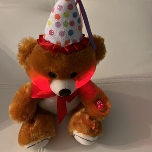 Happy birthday teddy bear. Plays tune.
Lights up